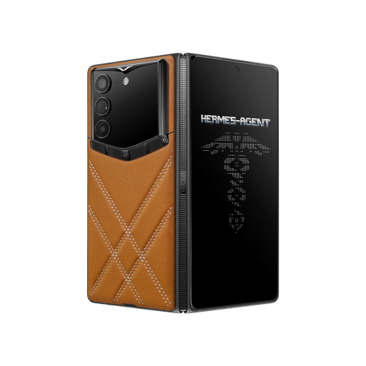 VERTU ALPHAFOLD Amber Brown folded phone standing upright with dark titanium frame and Hermes Agent emblem on screen
