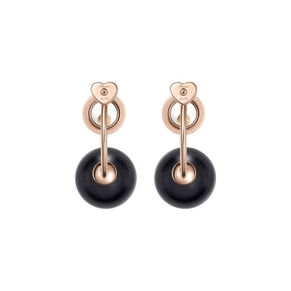 Chopard Happy Diamonds earrings in 18k ethical rose gold with diamonds and onyx view 4