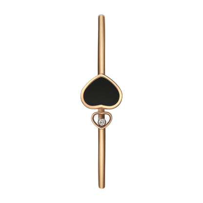 Chopard Happy Hearts bangle in 18k ethical rose gold with diamonds and onyx view 2