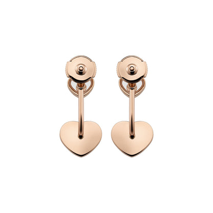 Chopard Happy Hearts earrings in 18k ethical rose gold with moving diamonds and onyx view 4